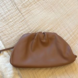 Similar the pouch bag in light brown